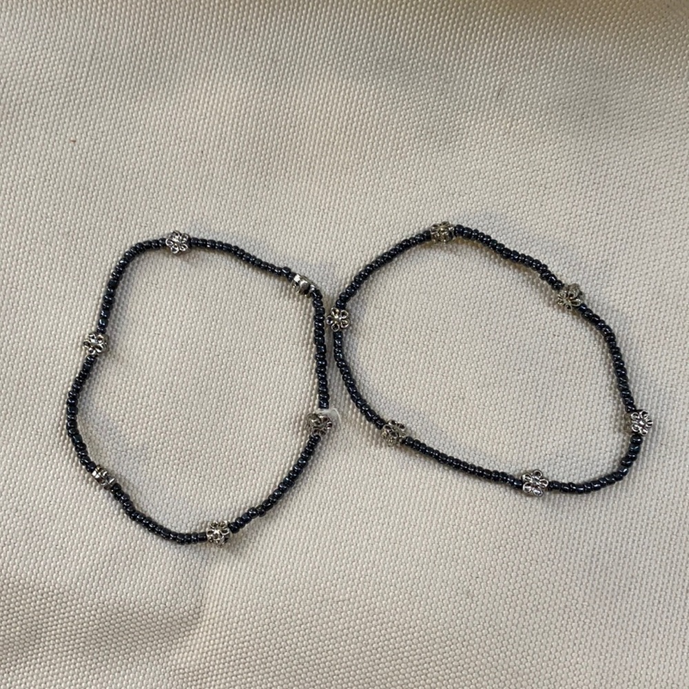 2 black bracelets